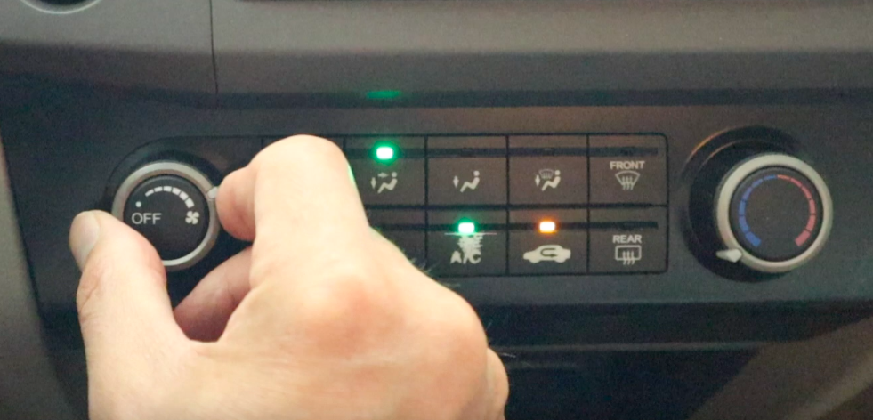Car AC controls set to max for DIY recharge