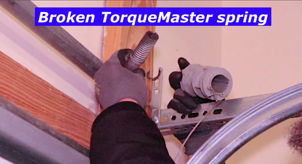 Broken Wayne Dalton TorqueMaster spring revealed once cable drum removed