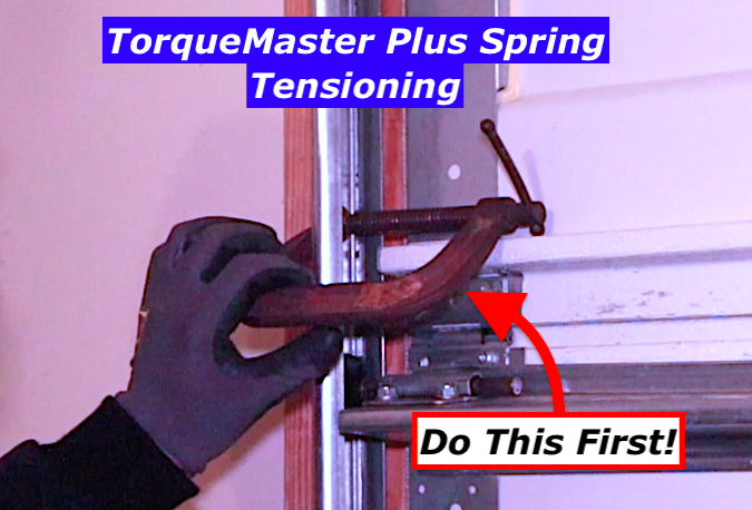 TorqueMaster Plus spring tensioning with door track clamped to prevent movement